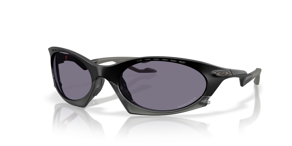 A pair of Oakley Plantaris OO9437 sunglasses with black frame, detachable noseguard, and gray lenses.
